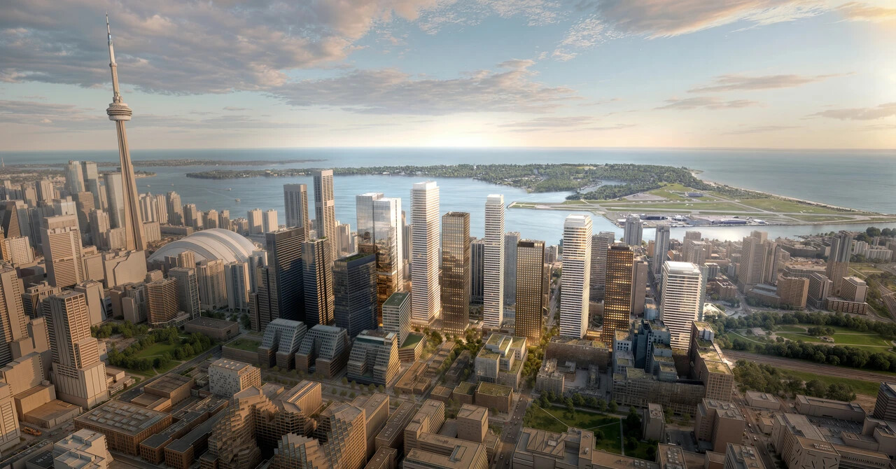 Aerial view of a modern cityscape at sunset with illuminated high-rise buildings, a prominent tower, and a lake in the background, creating a vibrant urban scene.